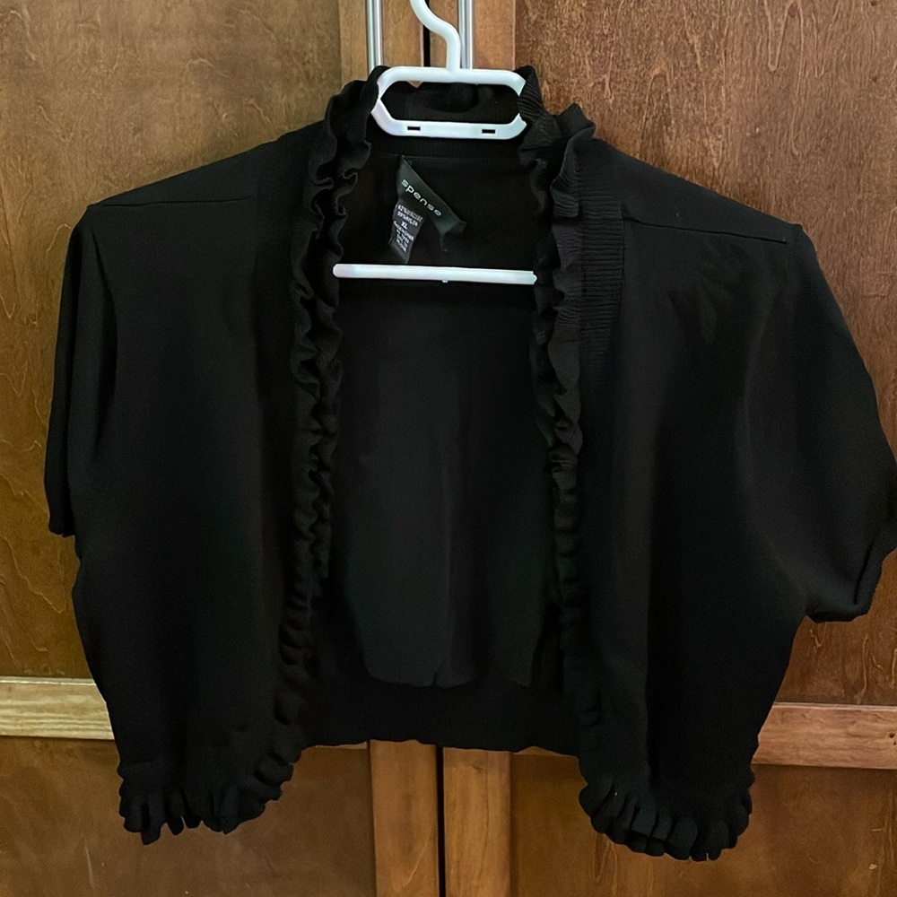 Spence short black borlero sweater.